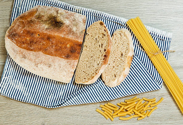 istock Ciabatta bread and pasta on a textured background 619767250
