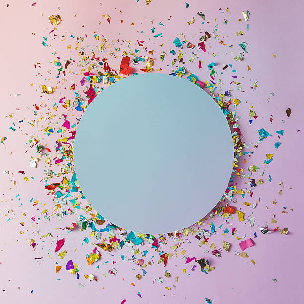 istock Colorful celebration background with party confetti on pink back 619767642