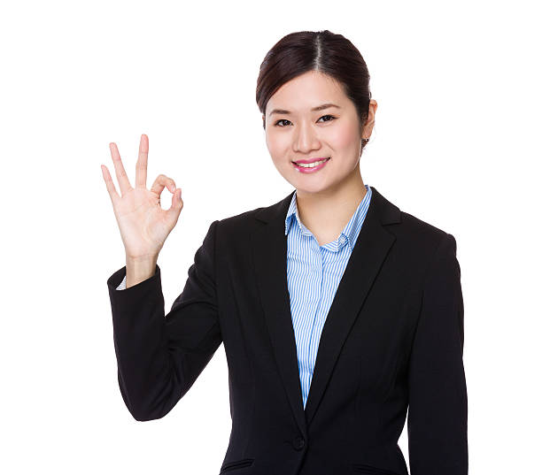 istock Businesswoman making ok sign 619767816