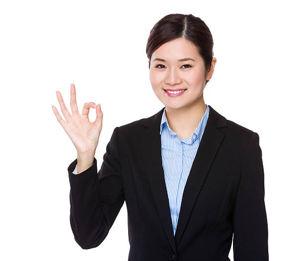 istock Businesswoman making ok sign 619767842