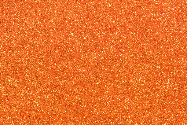 orange glitter textur abstrakt hintergrund - orange stock-fotos und bilder