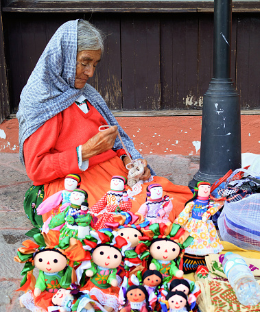 Tequisquiapan, Qro, Mexico - September 27, 2016: Portrait of an unknown indigenous mexican women. The woman is selling mexican art crafts in the street.