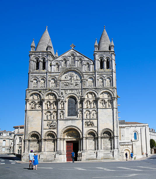 Romanesque Cathedral of Angouleme, France. Angouleme, France - August 7, 2016: Unidentified people near the Romanesque Cathedral of Angouleme, capital of the Charente department in France. angouleme stock pictures, royalty-free photos & images