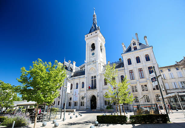 Town Hall of Angouleme, France. Angouleme, France - August 7, 2016: Unidentified people near the Town Hall (13th century) of Angouleme, capital of the Charente department in France. angouleme stock pictures, royalty-free photos & images