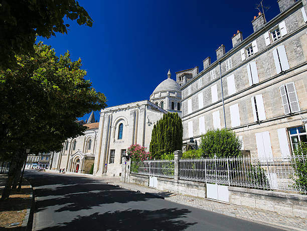 Angouleme, France. Angouleme, France - August 7, 2016: Unidentified people near the Romanesque Cathedral of Angouleme, capital of the Charente department in France. angouleme stock pictures, royalty-free photos & images