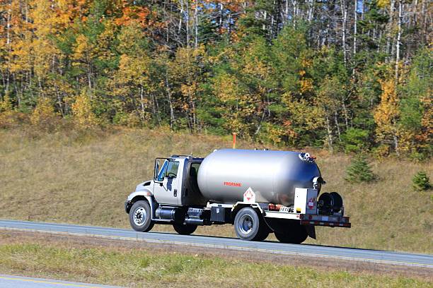 istock Propane truck, trees in background 619771198