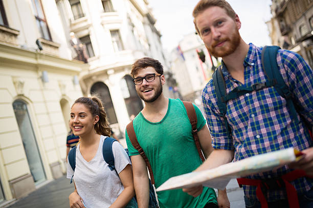 istock Happy tourists exploring city 619772786