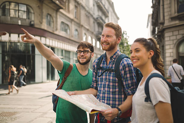 istock Happy traveling tourists sightseeing 619773230