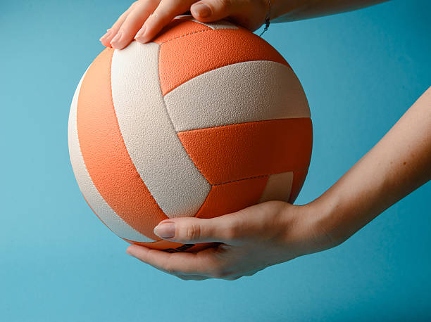 istock Volleyball in woman hands 619773322