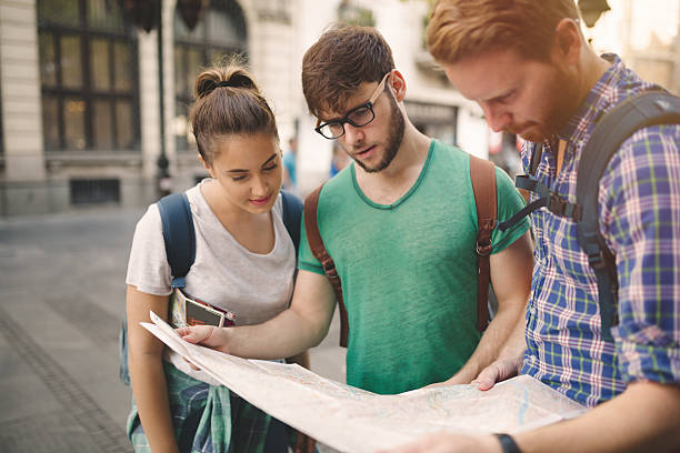 istock Happy tourists exploring city 619774200