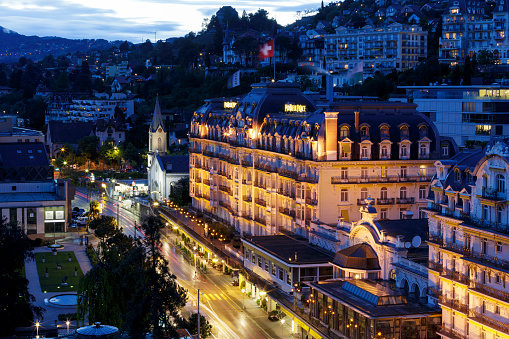 Montreux, Switzerland - May 19, 2013: Night view towards front facade of famous a five star luxury hotel \
