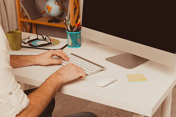 istock Close up photo of man's hands typing on keyboard 619774308