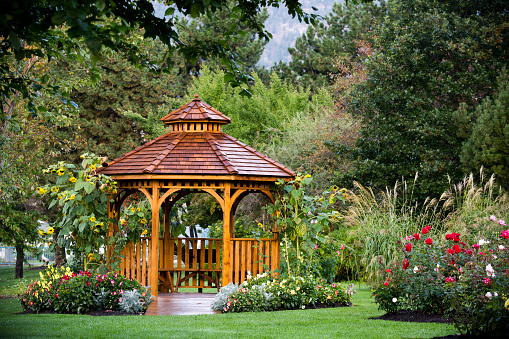 Cedar gazebo in a park at the Penticton Rose Garden located on the Trans Canada Trail in Penticton, British Columbia, Canada.