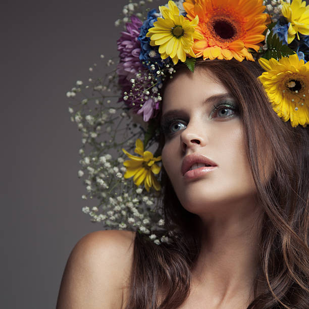 istock Beautiful Woman With Flower Wreath On Her Head. 619962412