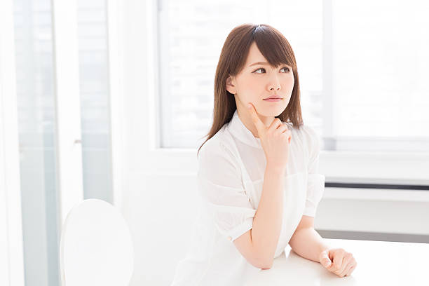 istock Japanese woman sitting on a chair 619962682