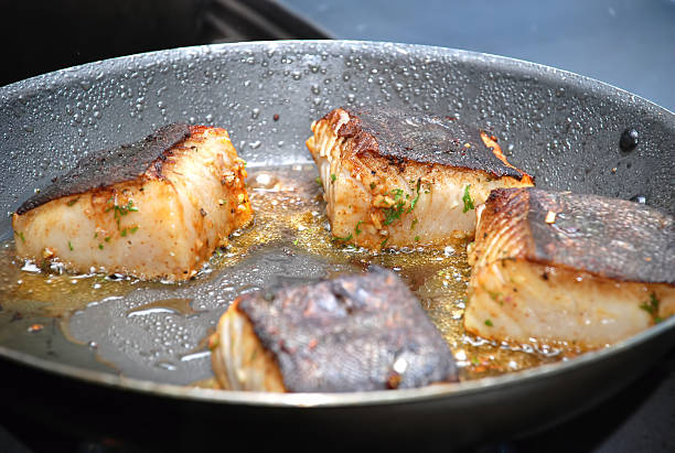 istock salmon fillet on hot pan, close-up. Shallow DOF 619962746