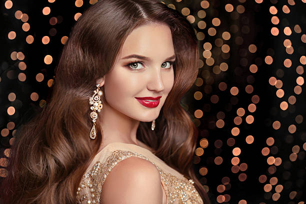 istock Makeup. Elegant hairstyle. Beautiful brunette smiling 619963442