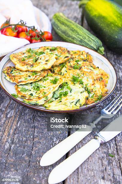 Squash And Zucchini Fritters On Old Wooden Table Stock Photo - Download Image Now - Appetizer, Backgrounds, Baked