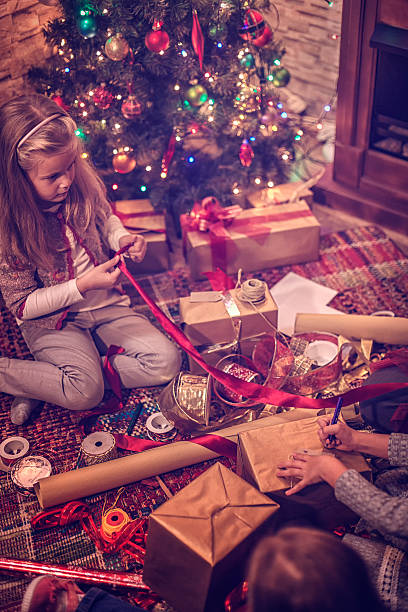 istock Wrapping and Decorating Christmas Presents 619963658