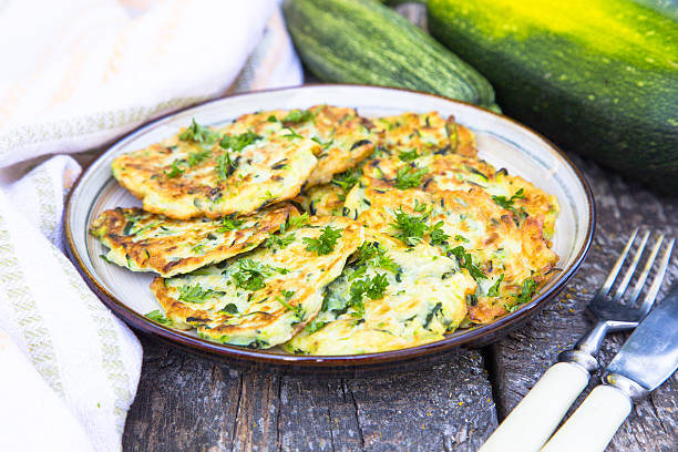 istock Squash and zucchini fritters on old wooden table 619963882