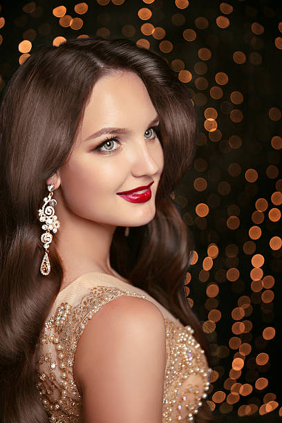 istock Makeup. Jewelry. Beautiful smiling woman model 619964144