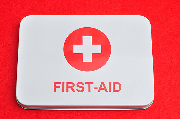 istock First aid sign isolated against a red background 619964740