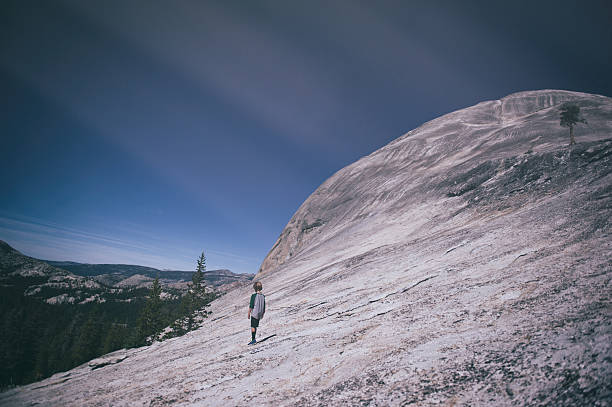 Child exploring the mountains of Tuolumne Meadows, Yosemite, California
