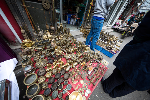 Tianjin,China- October 19, 2016: Tianjin Antique Market is said to be the biggest antiques distributing market in China. this market is filled with all kinds of shops selling porcelain items, silver, paintings, jade, gold, copper, etc. This is a place that is a must see on any travelers’ list. People are crowded at here.