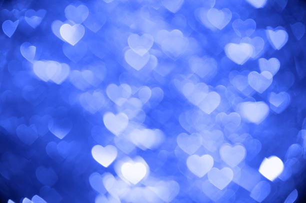 istock blue heart bokeh background photo, abstract holiday backdrop 619966290