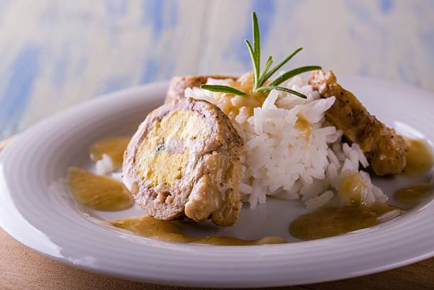 istock Portion of meat roll filled by eggs and rice 619966474