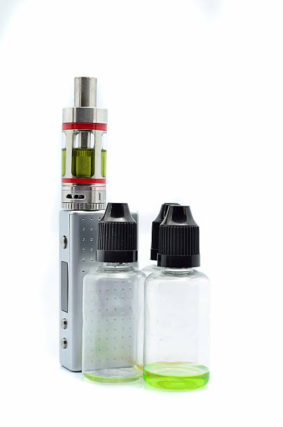 istock Electronic cigarette (e-cigarette) with empty flavor bottles isolated on white 619969222