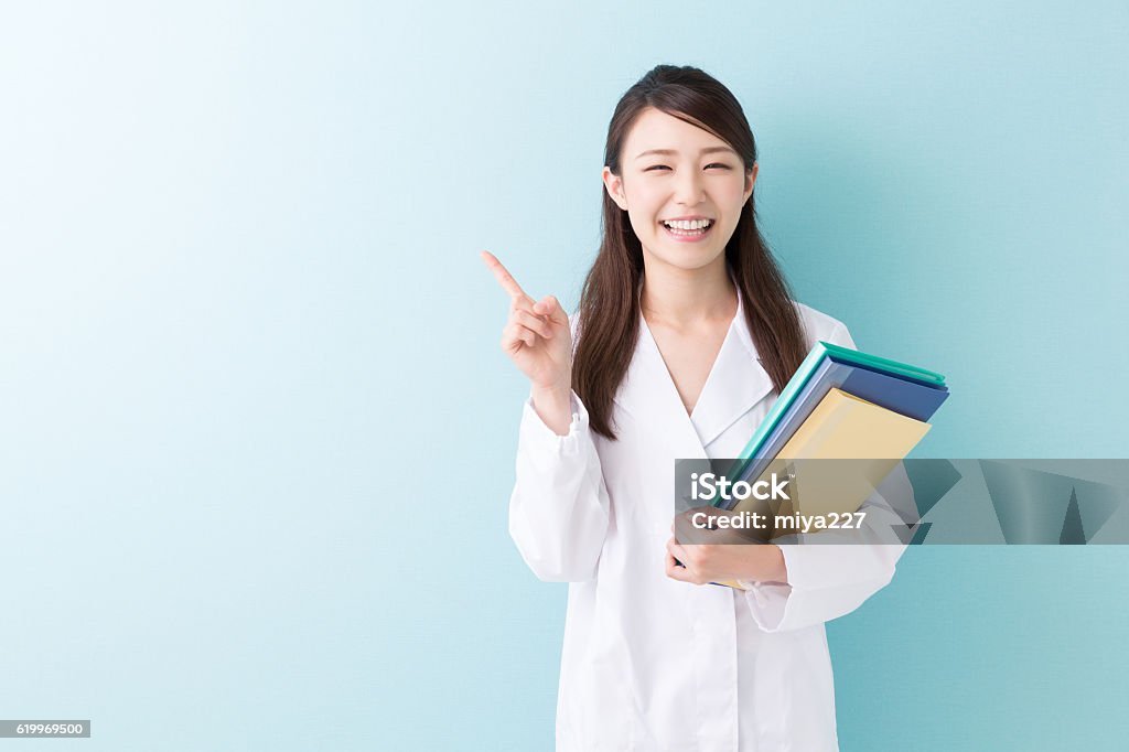Doctor holding files Women Stock Photo