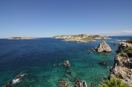 Tremiti Islands, Apulia, Italy. The islands of Caprara, St. Nicholas, Cretaccio and the little rock La Vecchia seen from the cliff of Punta Diamante, in San Domino island. Tremiti archipelago is part of Gargano national Park, off the cost of Apulia. Tremiti are the only Italian islands in the Adriatic sea.