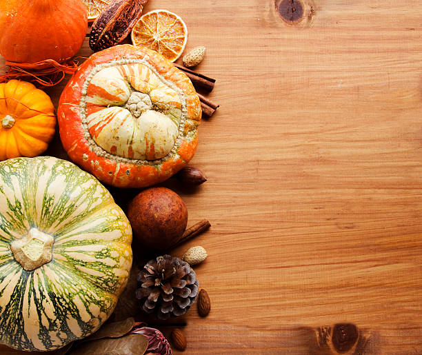 istock Seasonal wooden table setting with small pumpkins 619971544