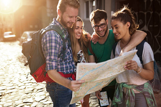 istock Happy tourists exploring city 619971572