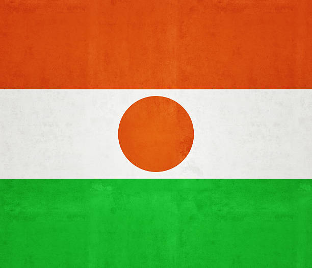 A horizontal triband of orange, white and green; charged with an orange circle in the center - the national Flag of Niger.