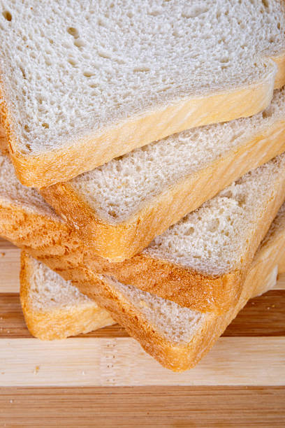 istock Slices of Toast Bread on Breadboard 619972288