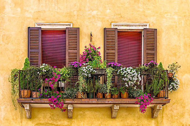 Balcony with flowers in Verona stock photo