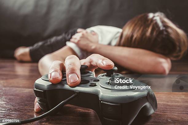 Young Man With Pad Stock Photo - Download Image Now - Video Game, Addiction, Gamer