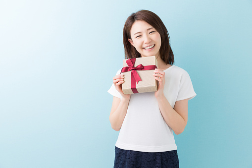 Japanese woman holding a gift box