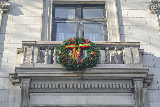 istock The Christmas wreath on the old building 619982348