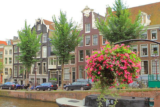 Amsterdan with its canals, streets and housing, and always flowers