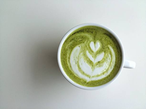 cup of matcha latte art so delicious on white