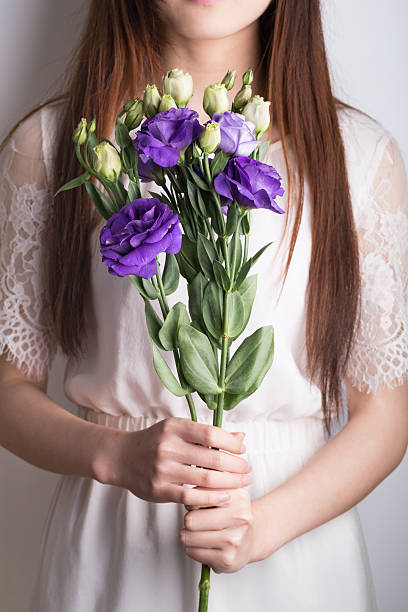 purple and white radix platycodi on grey background