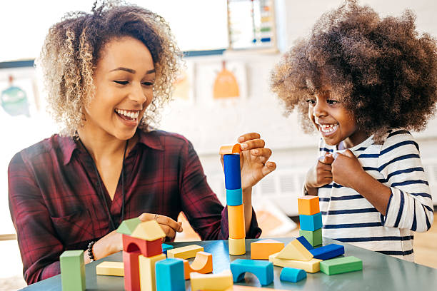 istock Speech therapist on session with toddler 619984298