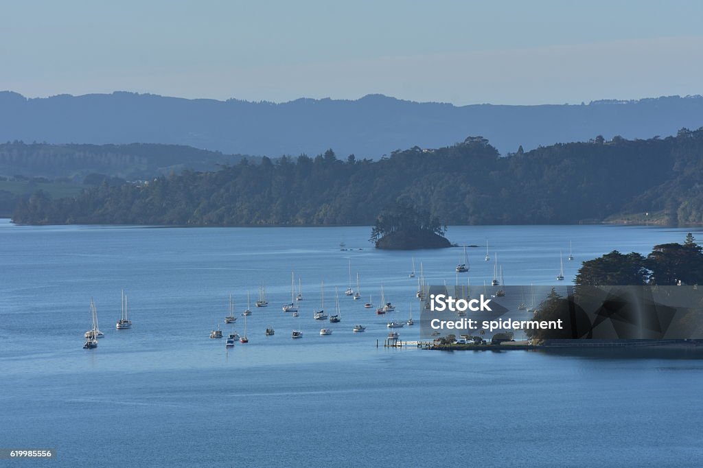 Mahurangi harbour view Scenery from inside Mahurangi Harbour with moored boats  on calm day. Bay of Water Stock Photo