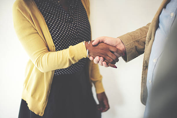 istock Handshake Gesturing People Connection Deal Concept 619987212