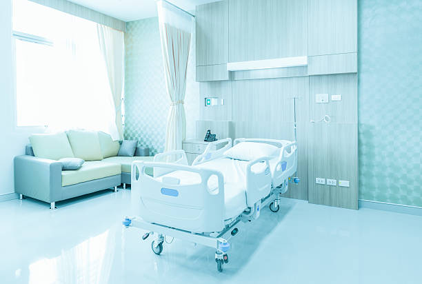 istock Hospital room with beds and comfortable medical equipped 619988624