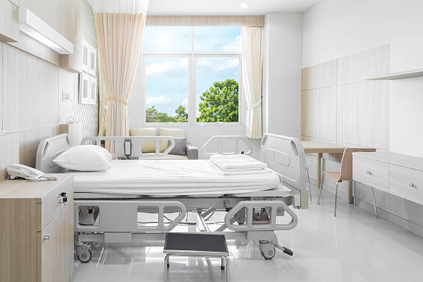 Hospital room with beds and comfortable medical equipped stock photo