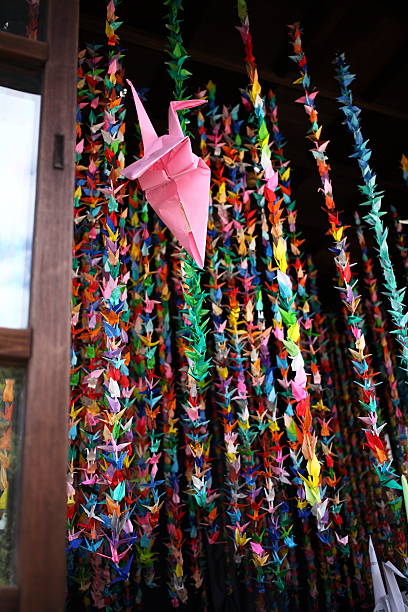 istock Thousand colorful origami paper cranes 619989222
